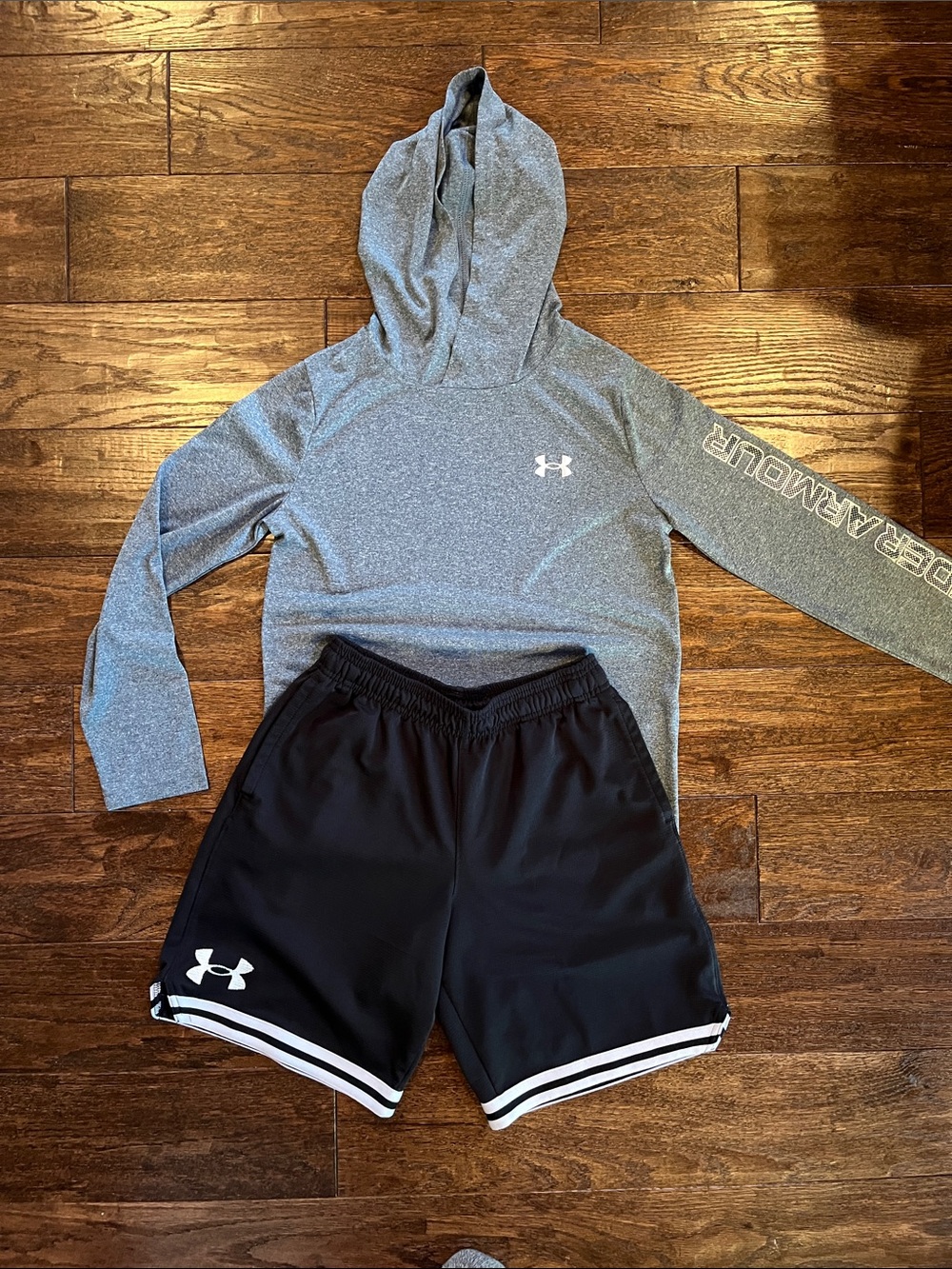 Boys Under Armour long sleeve gray hoodie size Medium  & black shorts size lg.